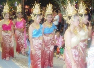 Beautiful goddesses follow the head deity in a procession around the festival grounds to inspect the food on offer.